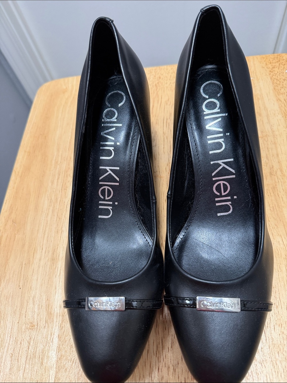 Calvin Klein Black Leather Pointed Toe Pumps with Logo Accent